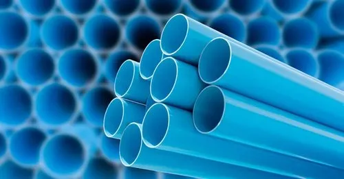 A stack of blue PVC pipe liners used for pipe lining in Mississauga, ON, with many more out of focus in the background.