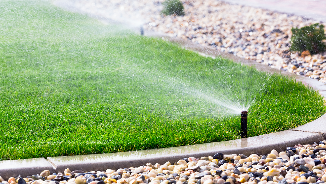 Sprinkler system watering a lawn.