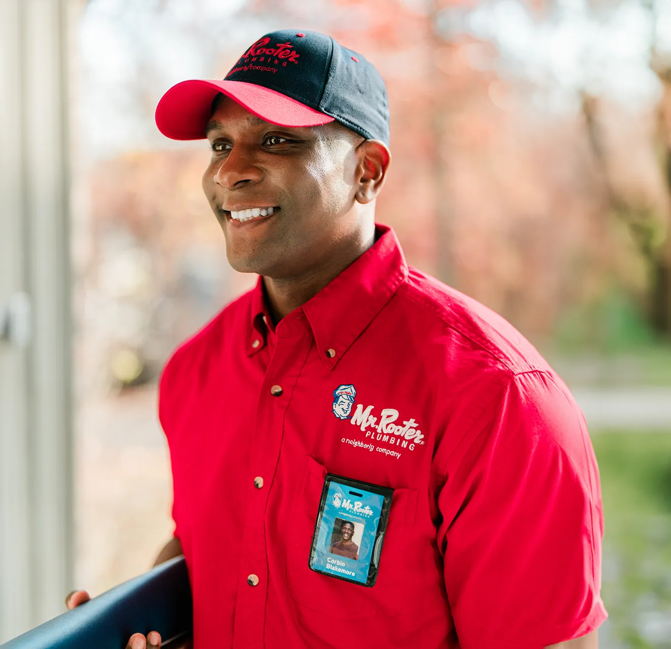 Close up portrait of a happy Mr. Rooter technician.