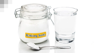 Baking soda container and cup of water