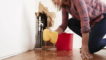 women sponge washing floor