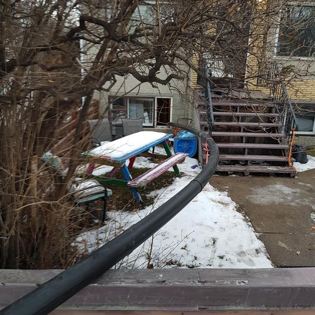 Sewer bursting - pipe coming in through the front window at a customers home in Edmonton